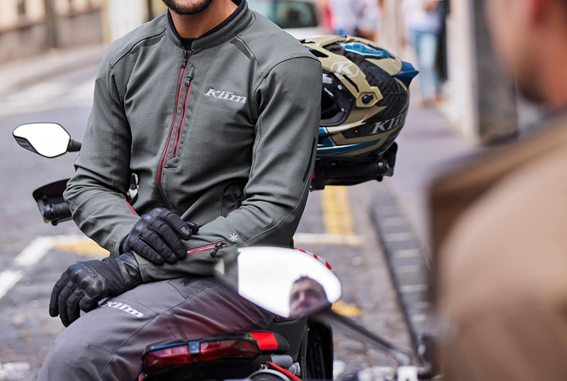 Guy wearing grey Klim Marrakesh jacket sat on bike